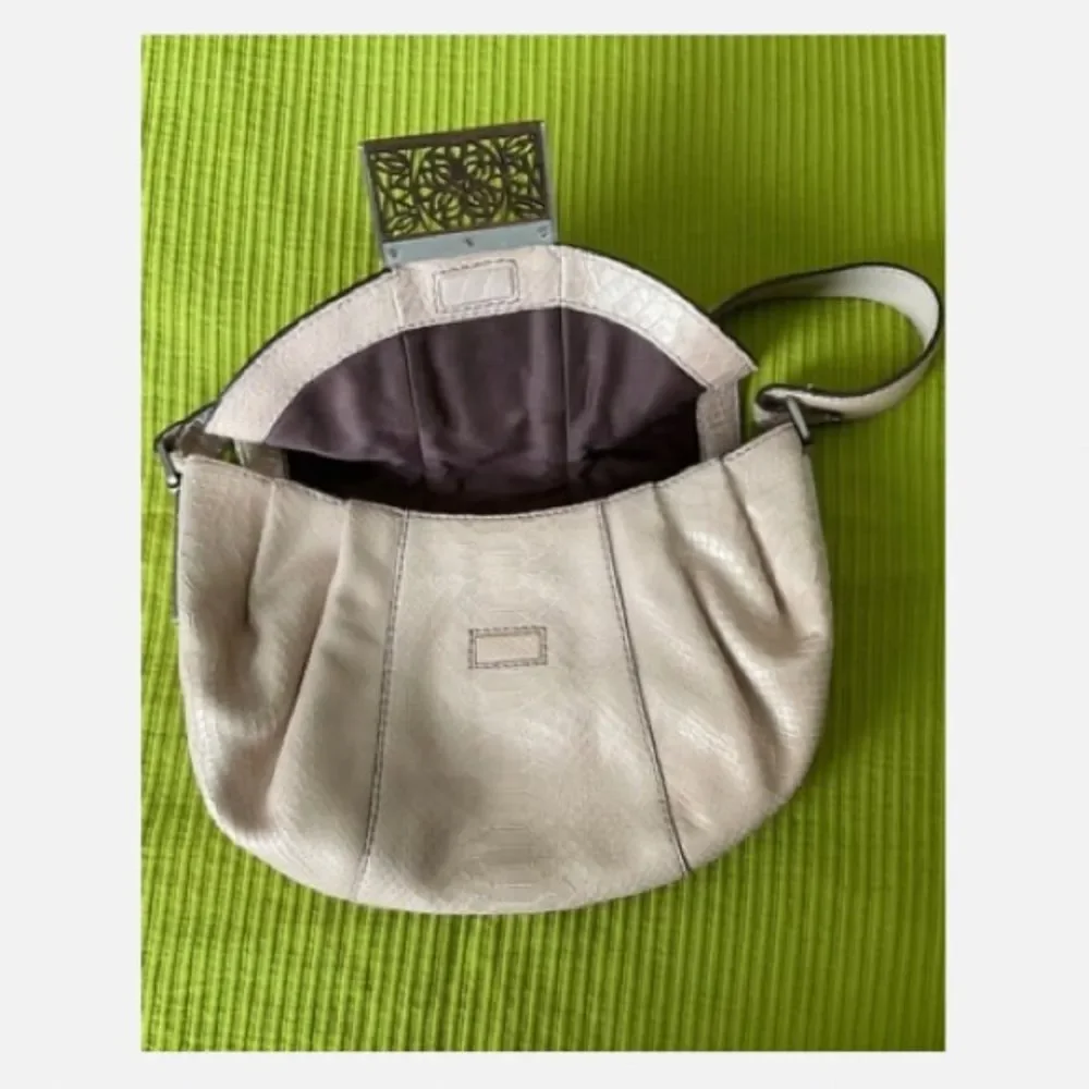 Calvin Klein Vintage Hobo Shoulder Bag with Carved Wood Flap Closure